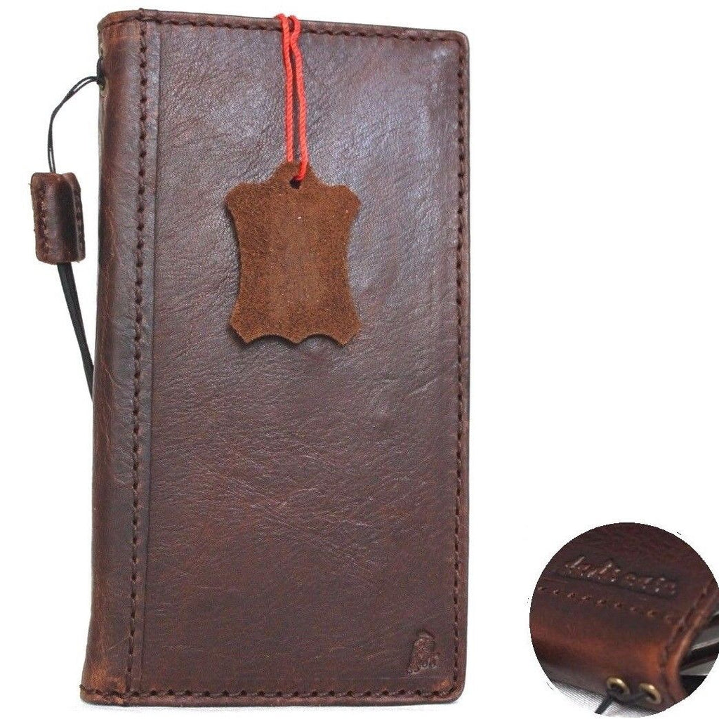 Genuine full leather iPhone 8 case with wallet design, elastic strap, card slots, and slim profile for wireless charging.