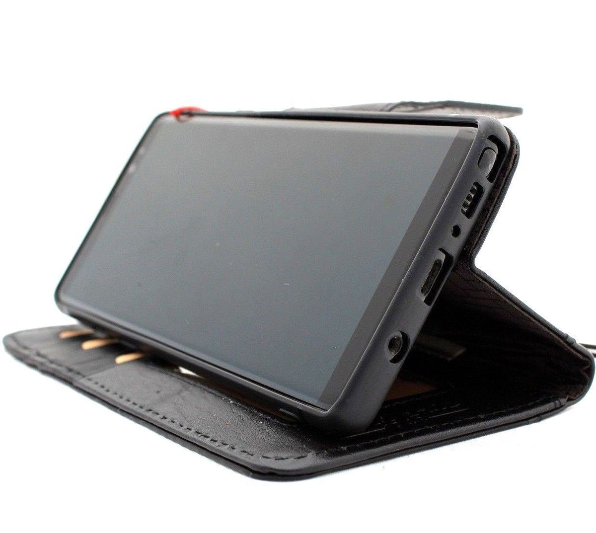 Black genuine leather Google Pixel 7 Pro case with wallet design, magnetic closure, stand feature, and embedded decorative accents.
