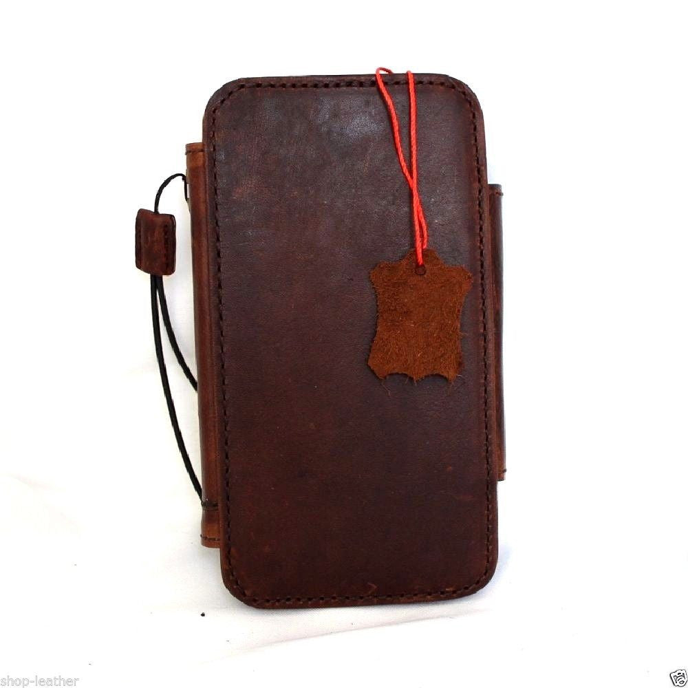 Handmade genuine leather iPhone 6s Plus case with wallet, credit card slots, ID window, and magnetic closure.