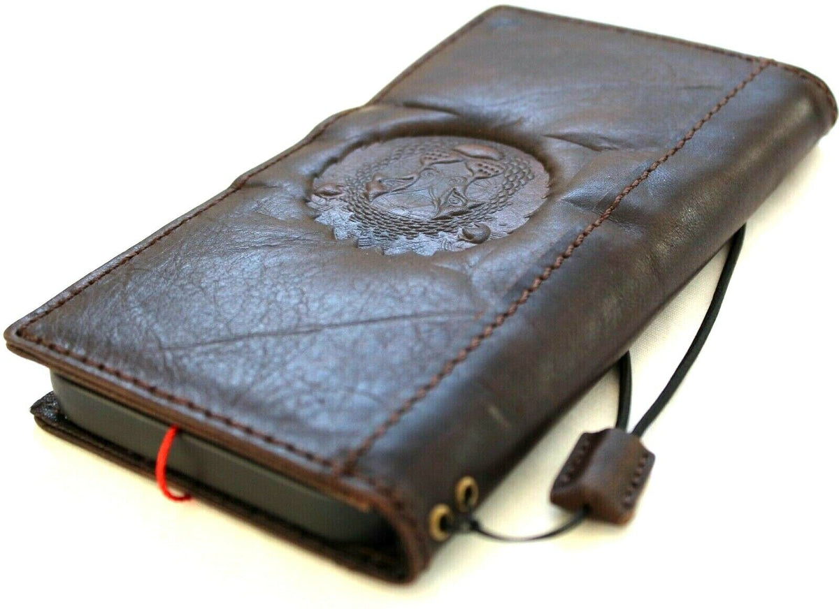 Handcrafted genuine leather wallet case for iPhone 11-15 Pro Max, featuring vintage lion design, credit card slots, and full grain leather.