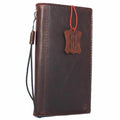 Genuine full leather iPhone 8 case with wallet design, elastic strap, and luxury finish, compatible with wireless charging.