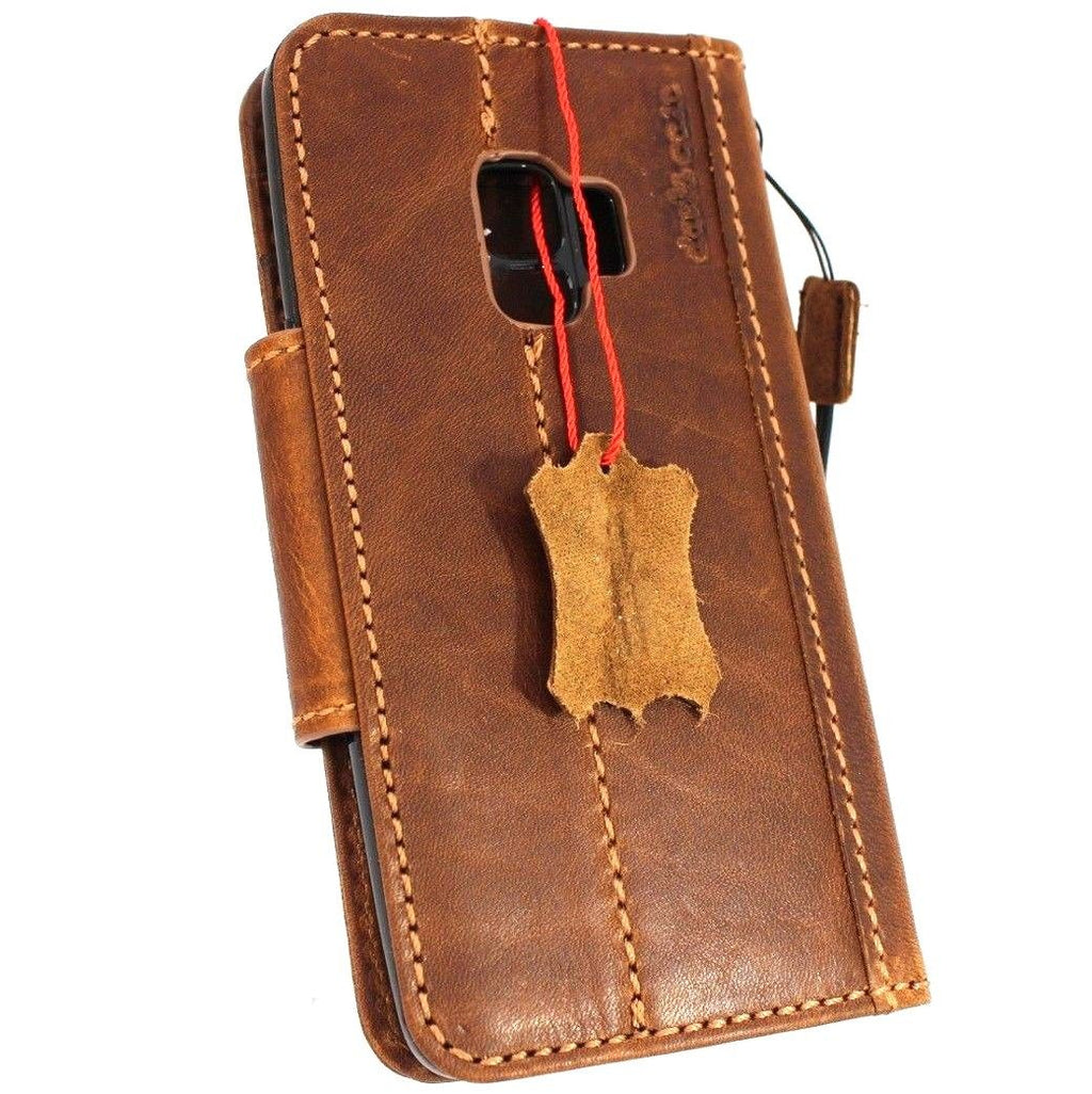 Handmade genuine leather wallet case for Samsung Galaxy S9 with magnetic closure, designed for protection and style.