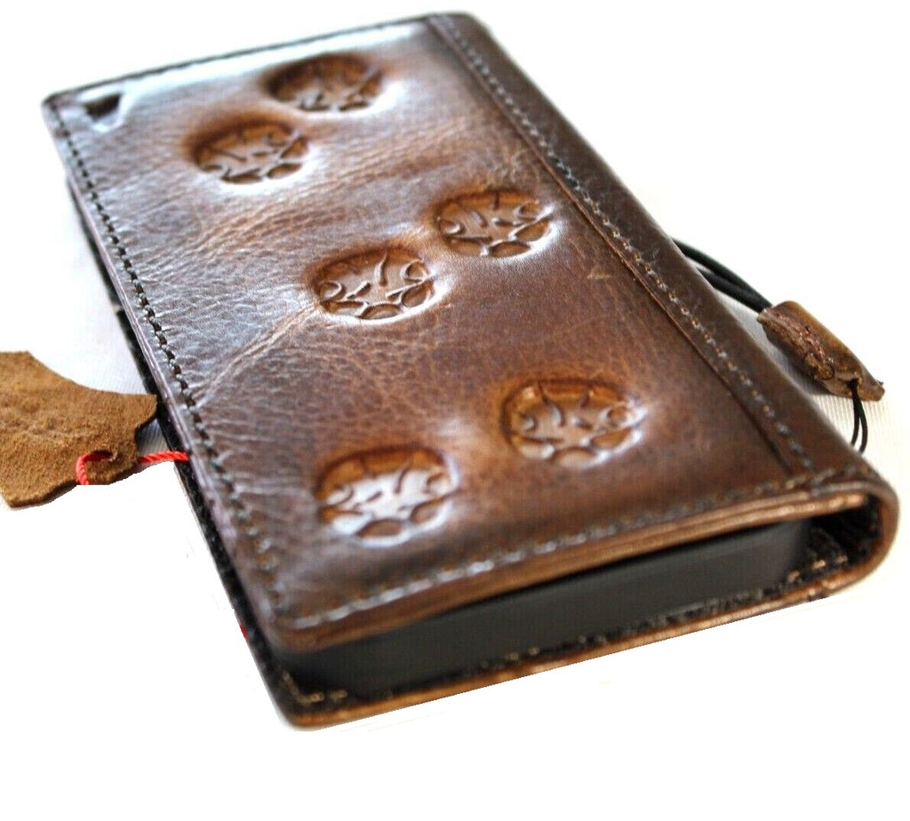 Handmade genuine leather phone case for iPhone models with vintage dog paw and tiger stamping, featuring credit card slots and full grain leather.